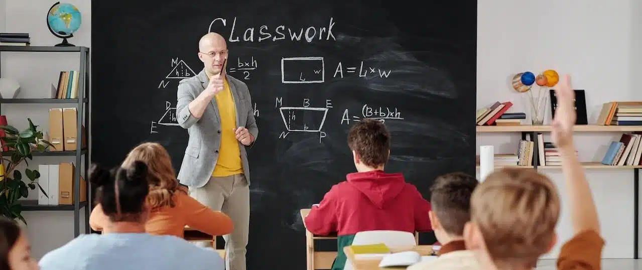 teacher and students in a school setting