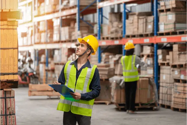 Worker checking stocks in a manufacturing company.