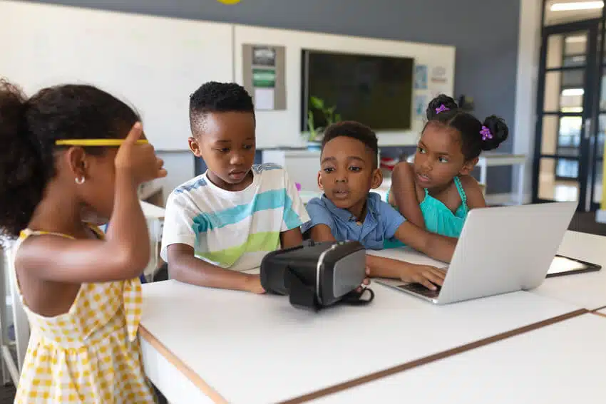 Young students use VR in the classroom.