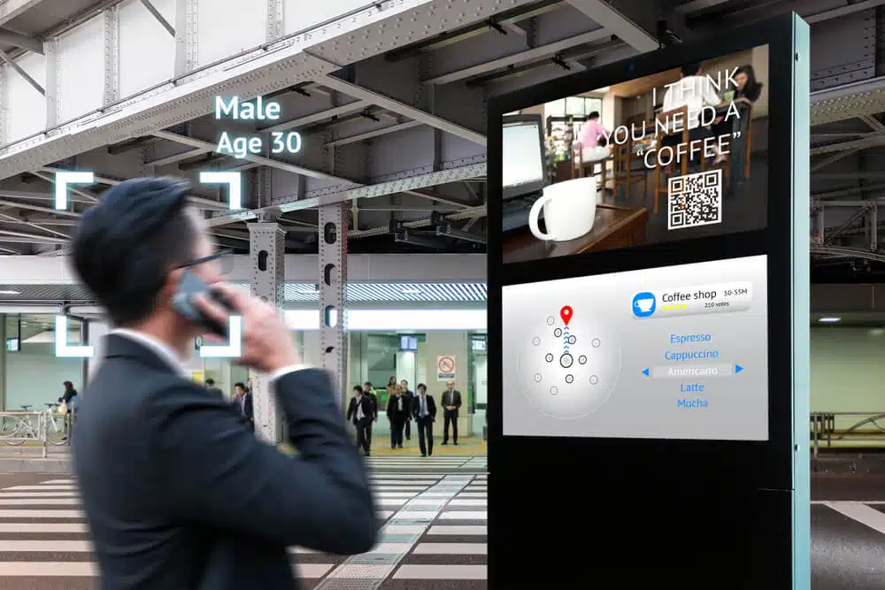 An employee using digital signage to check company's information.