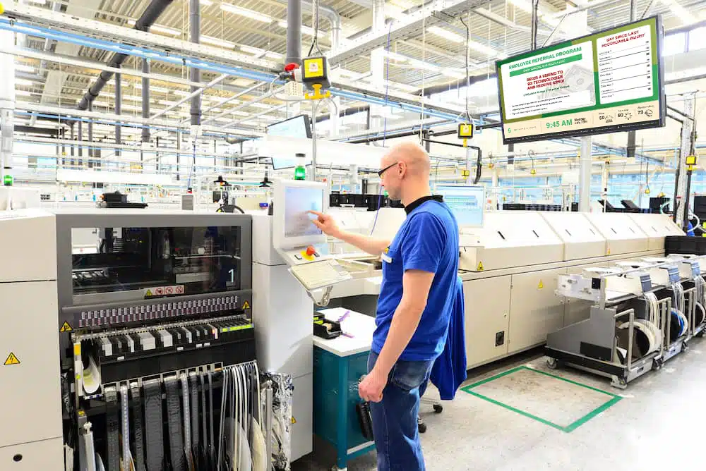 A manufacture employee working on the machine.