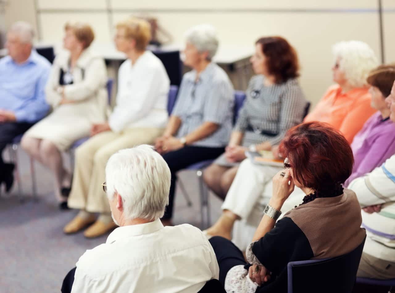 Group of seniors in community center.