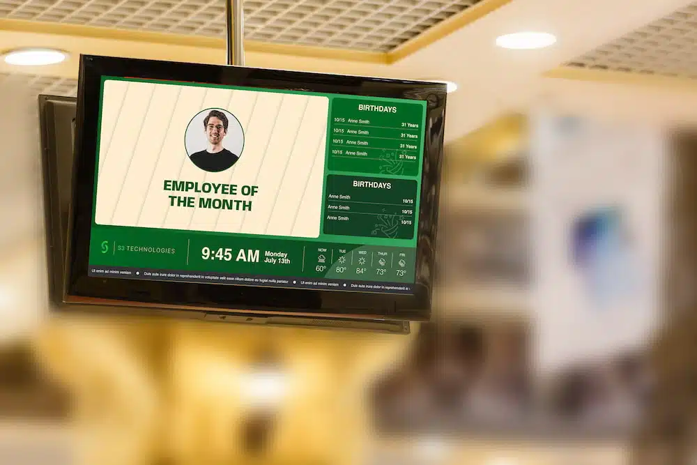 Digital signage inside the office building, displaying the Employee of the month .