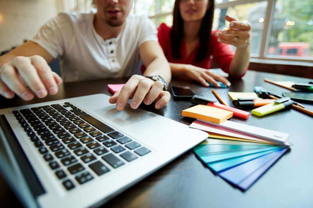 Marketing team searching online for the right digital signage provider.