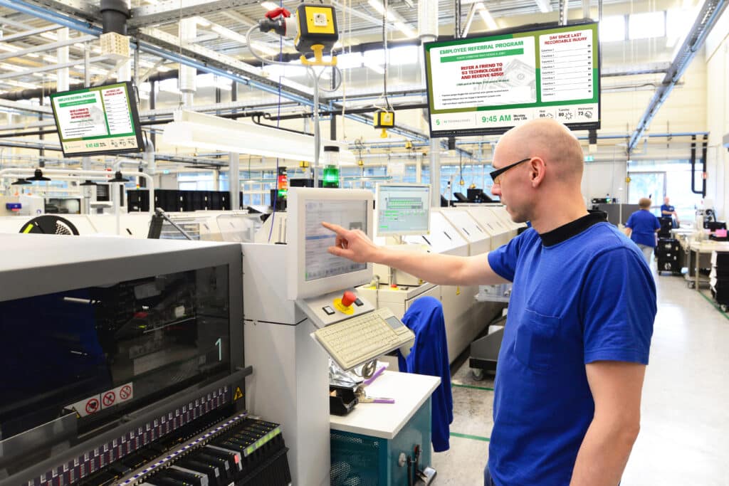 A manufacture employee working on the machine.