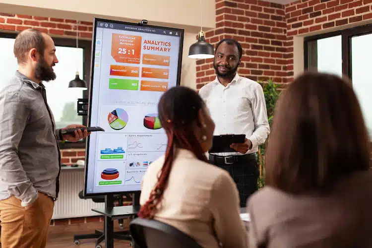 African American entrepreneur showing business graph KPI