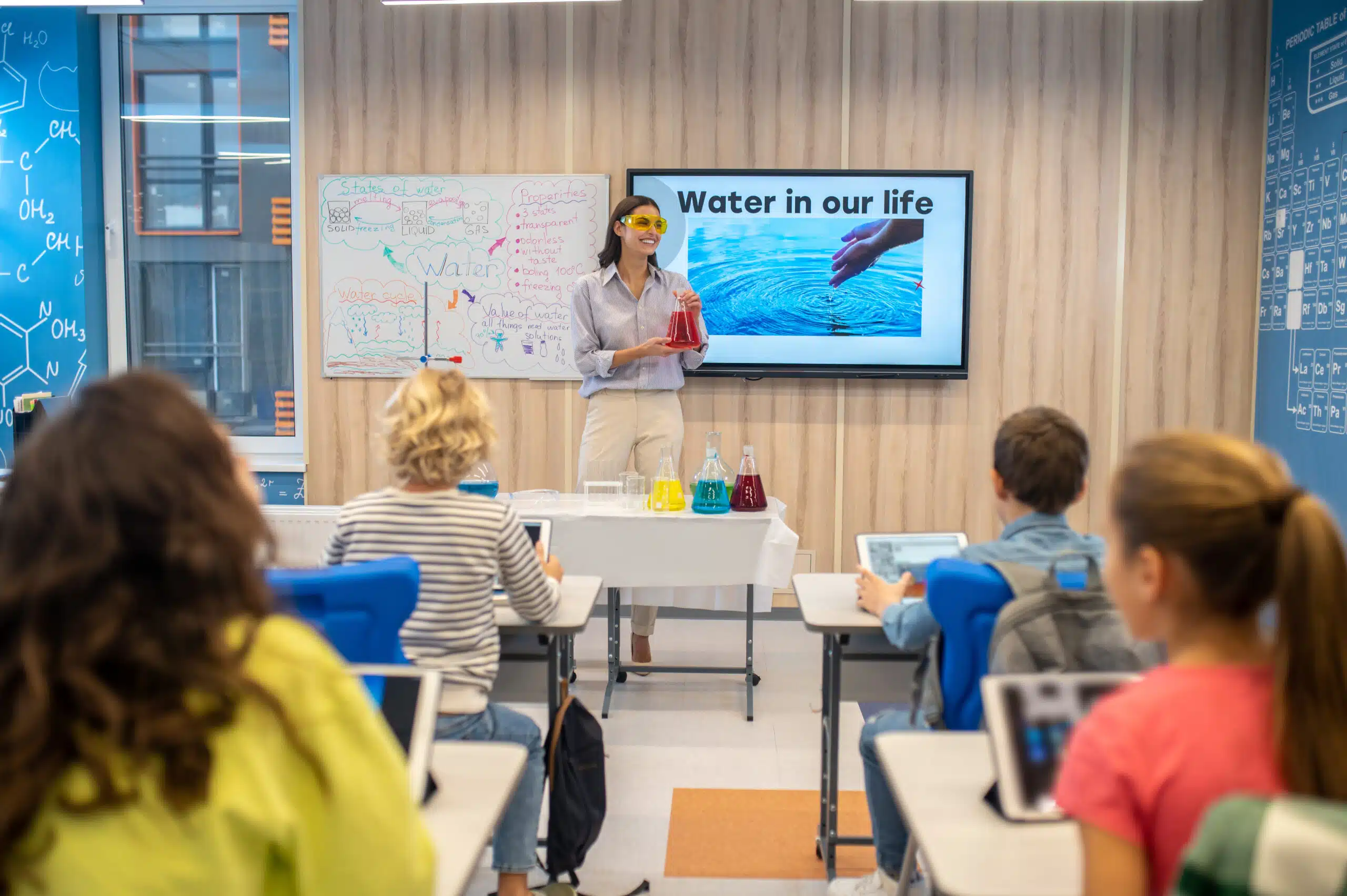 A teacher using a PowerPoint presentation in the class.