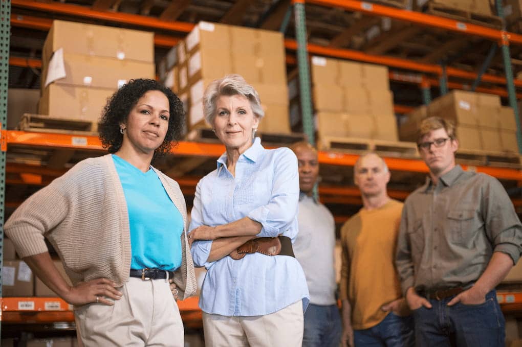 Warehouse workers infront of boxes