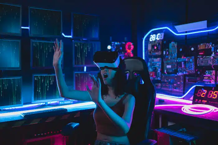 XR solutions: girl with VR headset playing in her game room