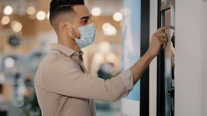 man touching screen of  dynamic Digital Signage in Charlotte