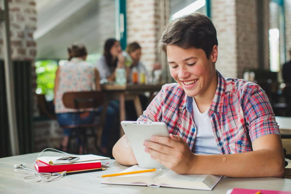 student using tablet for school